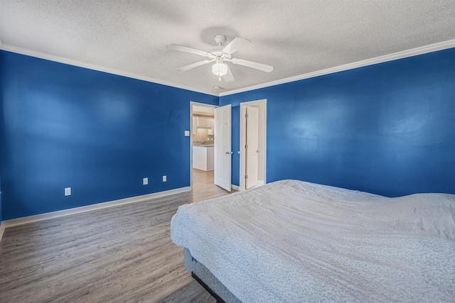 bedroom featuring ceiling fan, ornamental molding, light hardwood / wood-style flooring, and a textured ceiling