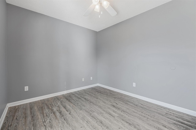 empty room featuring hardwood / wood-style floors and ceiling fan