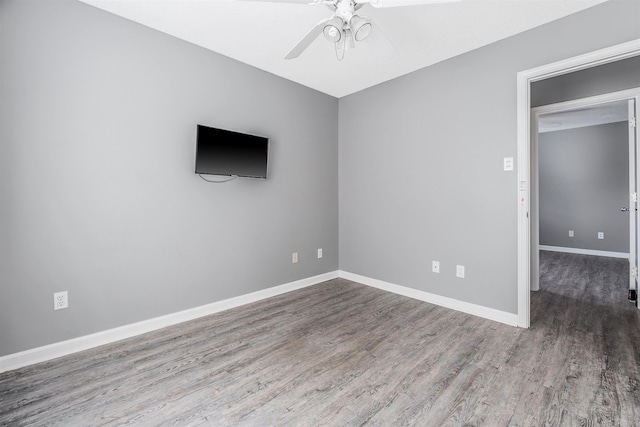 spare room featuring hardwood / wood-style flooring and ceiling fan