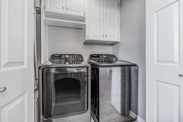 laundry area with cabinets and washer and dryer