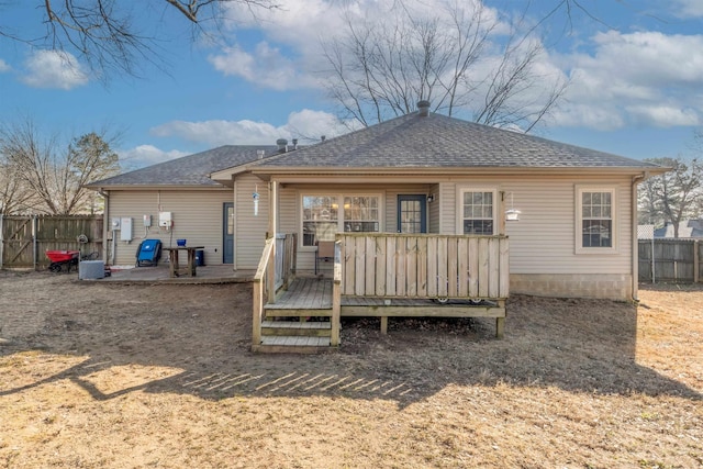 back of property with a deck