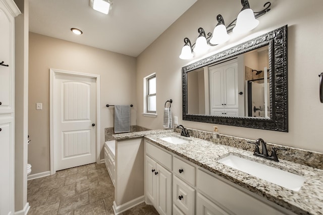 full bathroom with vanity, shower with separate bathtub, and toilet