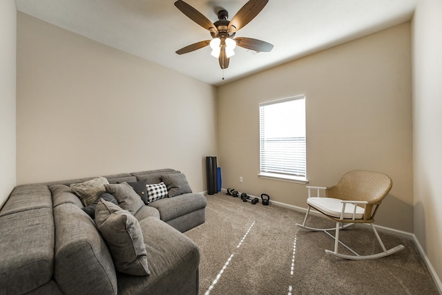 living room with ceiling fan and carpet floors