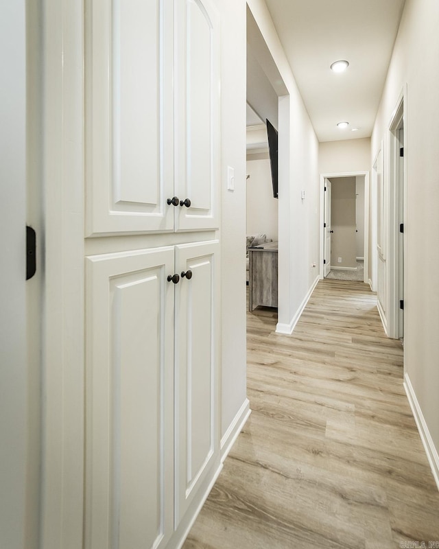 hallway featuring light hardwood / wood-style floors