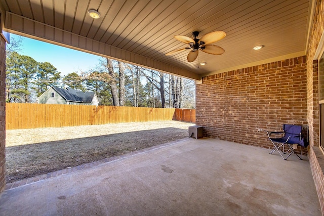 view of patio featuring ceiling fan