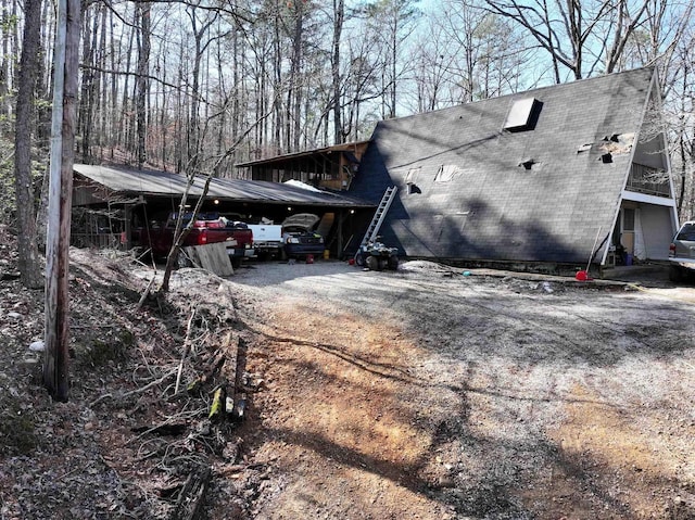 view of home's exterior with a carport