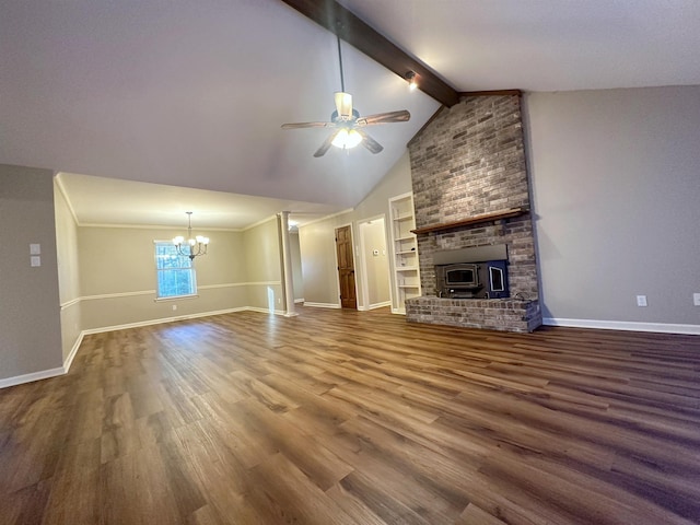 unfurnished living room with lofted ceiling with beams, ceiling fan with notable chandelier, hardwood / wood-style floors, and built in shelves