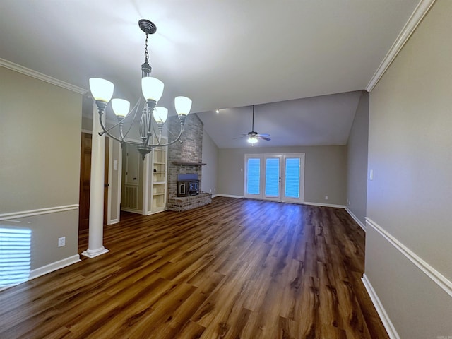 unfurnished living room with vaulted ceiling, dark hardwood / wood-style floors, ceiling fan with notable chandelier, a fireplace, and crown molding