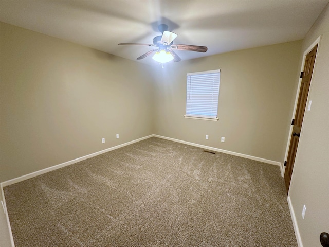 carpeted empty room with ceiling fan