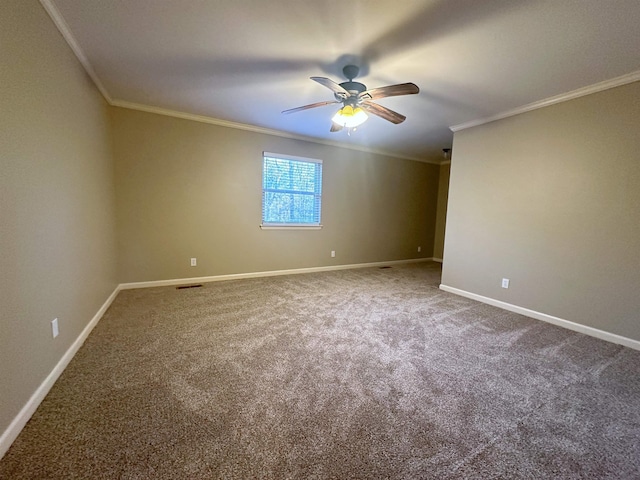 empty room featuring crown molding, ceiling fan, and carpet flooring