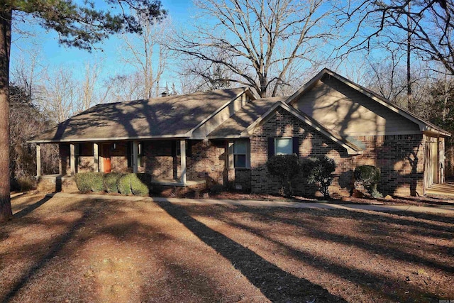 ranch-style house featuring covered porch