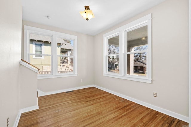 unfurnished dining area with wood-type flooring