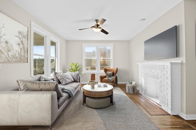 living room featuring hardwood / wood-style flooring and ceiling fan