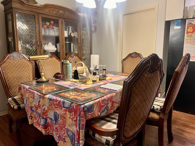 dining area with wood-type flooring