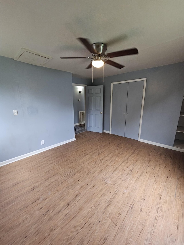 unfurnished bedroom with a closet, ceiling fan, and light wood-type flooring