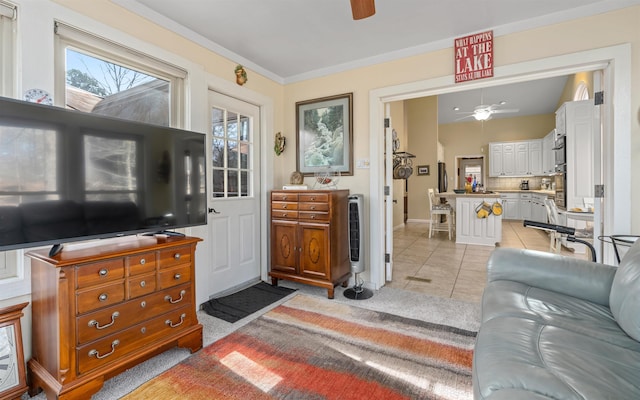 tiled living room with ceiling fan