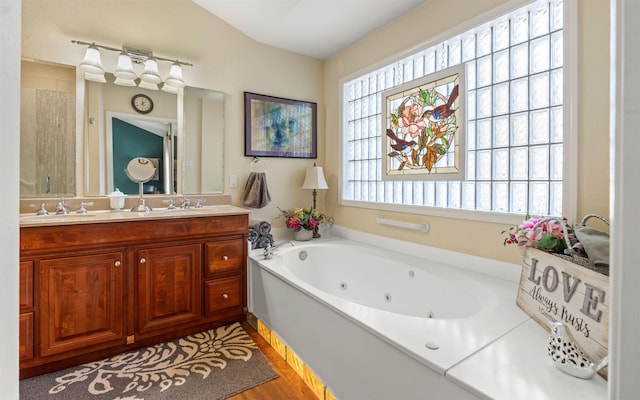 bathroom with vanity, separate shower and tub, and wood-type flooring