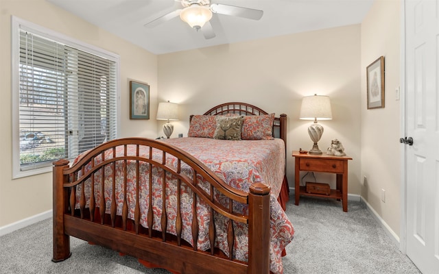 bedroom featuring light colored carpet and ceiling fan