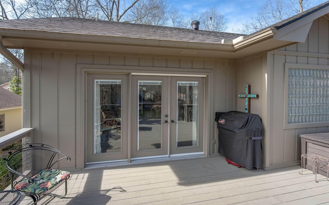 wooden terrace featuring area for grilling and french doors