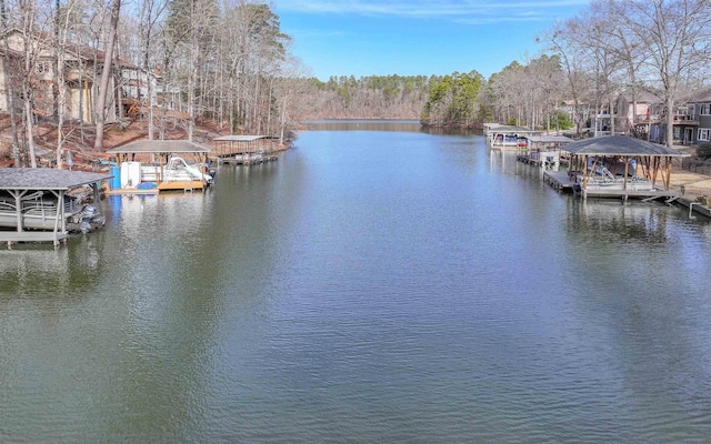 view of dock featuring a gazebo and a water view