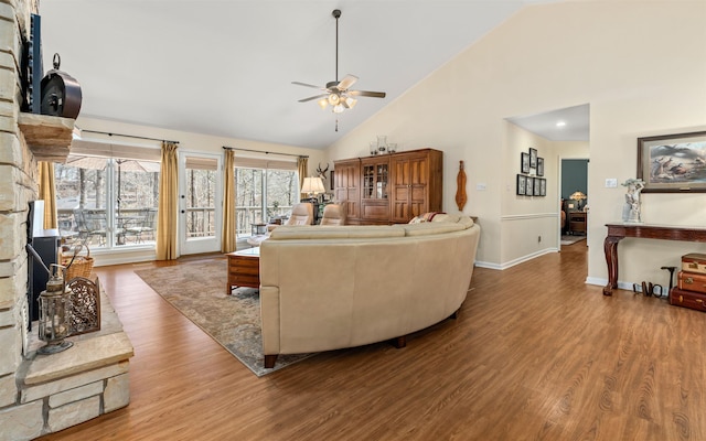 living room featuring ceiling fan, high vaulted ceiling, and hardwood / wood-style floors