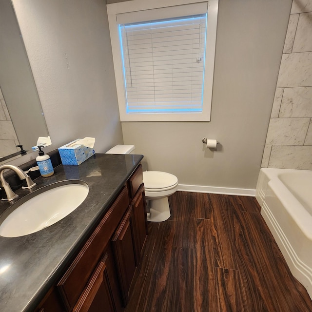 506 W Pleasure, Searcy, AR 72143 - bathroom featuring vanity, hardwood / wood-style floors, and toilet