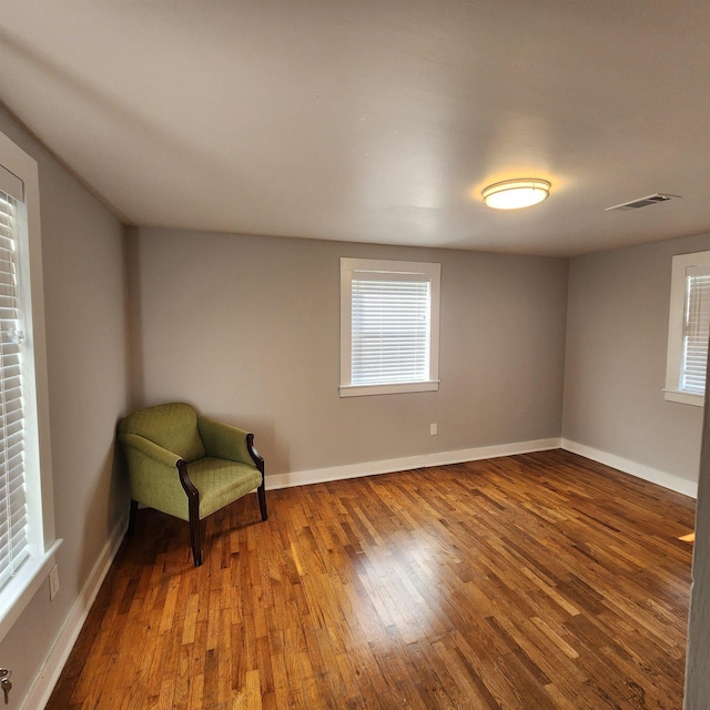 506 W Pleasure, Searcy, AR 72143 - unfurnished room with hardwood / wood-style flooring and a healthy amount of sunlight
