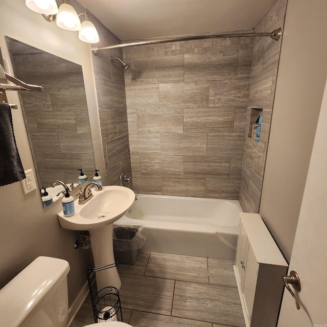 506 W Pleasure, Searcy, AR 72143 - bathroom featuring tiled shower / bath and toilet