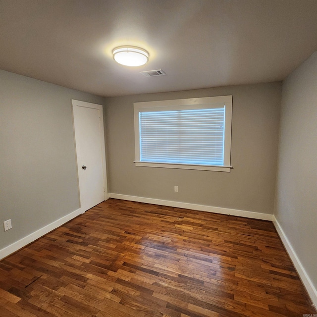 506 W Pleasure, Searcy, AR 72143 - empty room with dark hardwood / wood-style floors