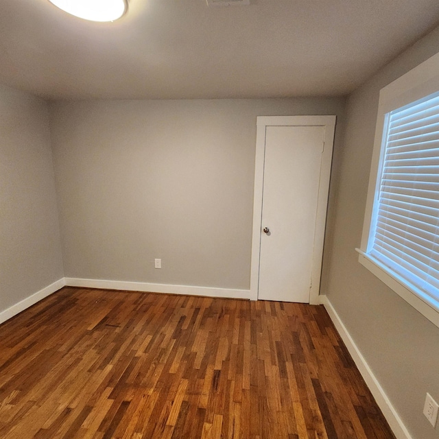 506 W Pleasure, Searcy, AR 72143 - spare room with dark hardwood / wood-style floors