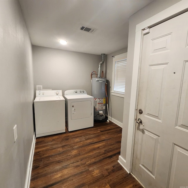 506 W Pleasure, Searcy, AR 72143 - washroom with gas water heater, dark hardwood / wood-style floors, and washing machine and clothes dryer