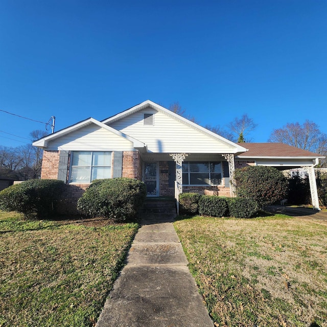 506 W Pleasure, Searcy, AR 72143 - view of front facade featuring a carport and a front yard