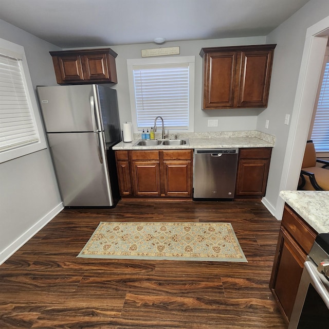 506 W Pleasure, Searcy, AR 72143 - kitchen featuring light stone counters, stainless steel appliances, dark hardwood / wood-style flooring, and sink