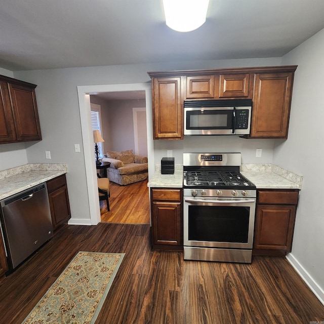 506 W Pleasure, Searcy, AR 72143 - kitchen featuring stainless steel appliances and dark hardwood / wood-style floors