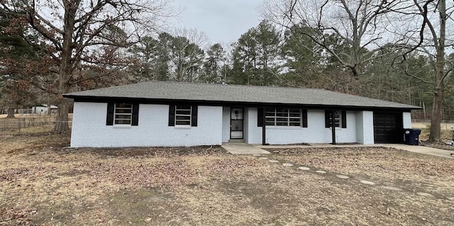 ranch-style house featuring a garage