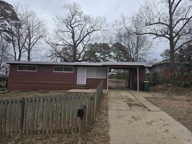 view of front of home featuring a carport