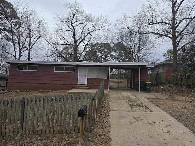 ranch-style home with a carport