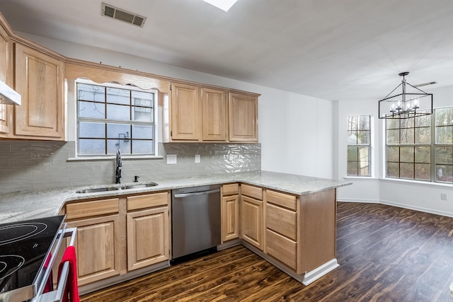 kitchen featuring sink, hanging light fixtures, appliances with stainless steel finishes, dark hardwood / wood-style flooring, and kitchen peninsula