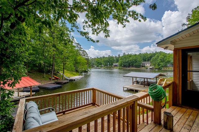 deck featuring a water view and a boat dock