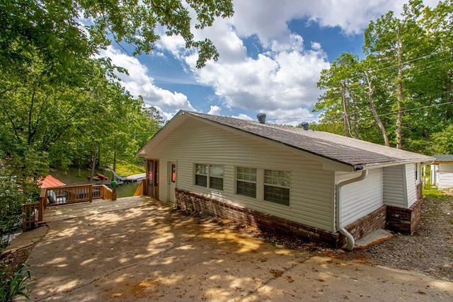 view of home's exterior with a deck