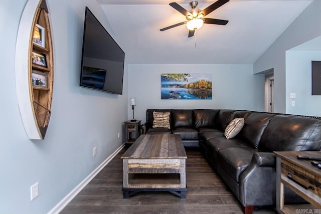 living room featuring ceiling fan, dark hardwood / wood-style floors, and vaulted ceiling