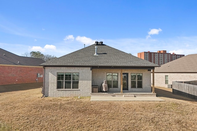 back of house featuring a patio, central AC unit, and a lawn