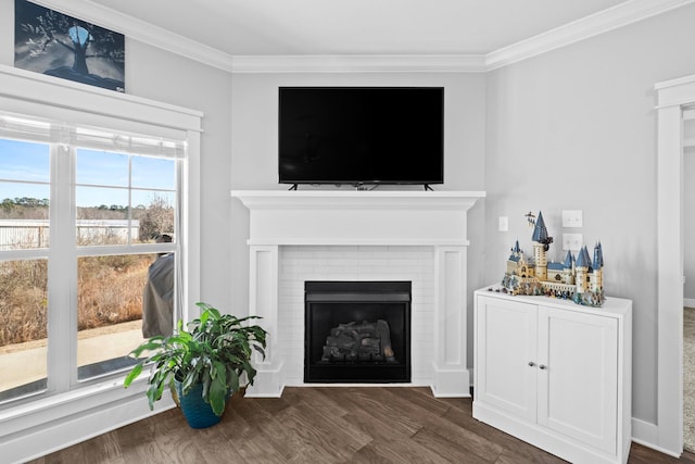 living room featuring ornamental molding, a brick fireplace, and dark hardwood / wood-style floors