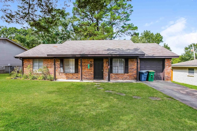 single story home with a garage and a front lawn