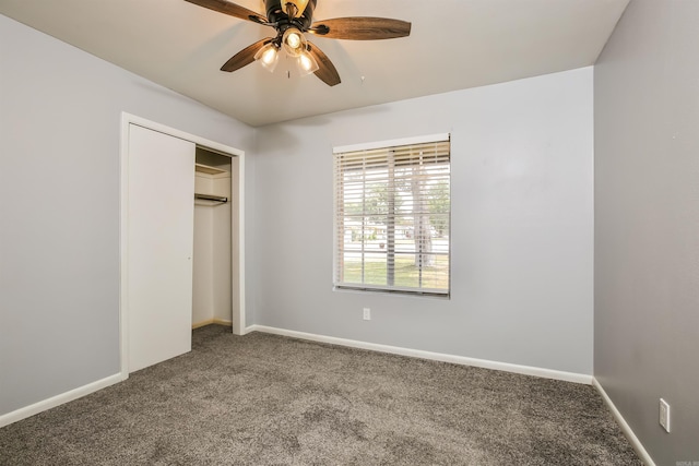 unfurnished bedroom featuring carpet, ceiling fan, and a closet