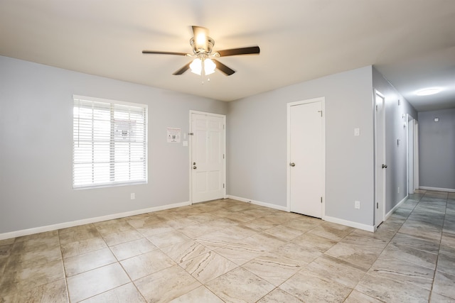 spare room with ceiling fan