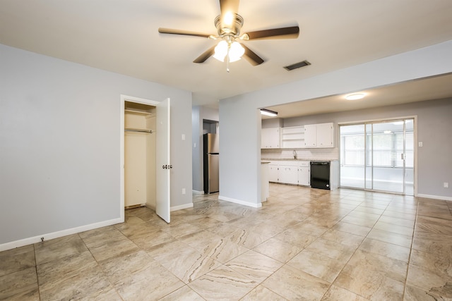 unfurnished living room with sink and ceiling fan