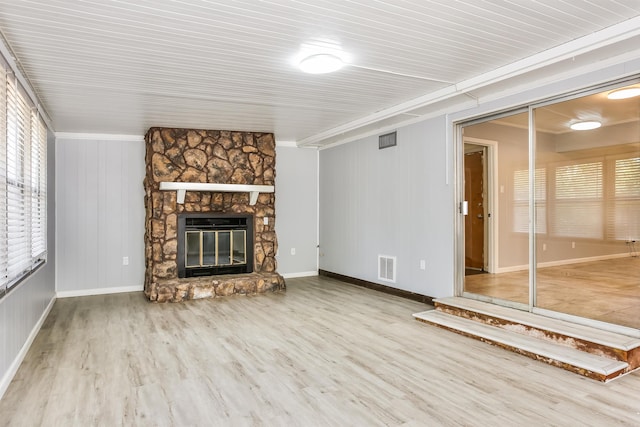 unfurnished living room with a fireplace and hardwood / wood-style floors