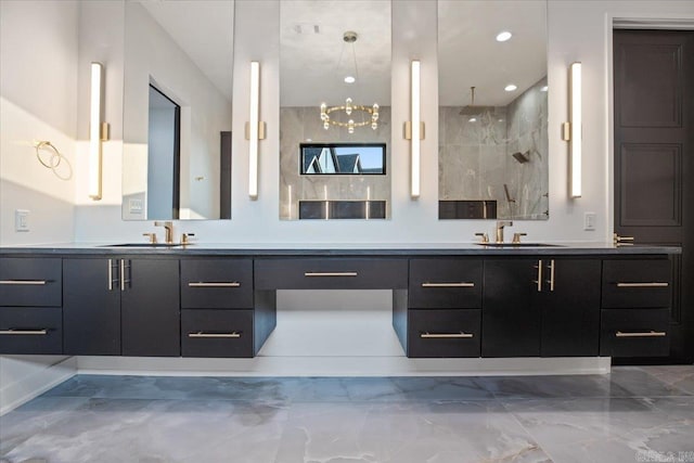 bathroom featuring walk in shower and vanity