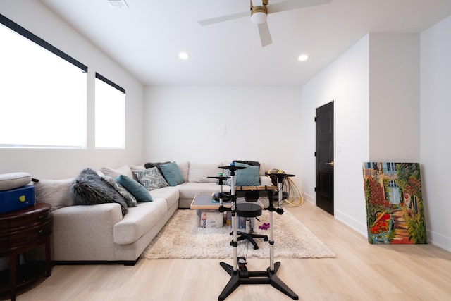 office space with ceiling fan and light hardwood / wood-style floors